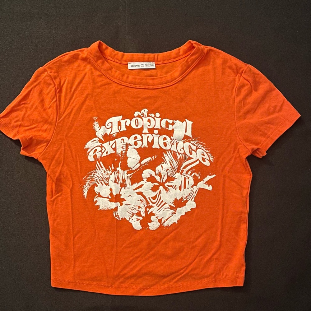 Bright orange tropical baby tee